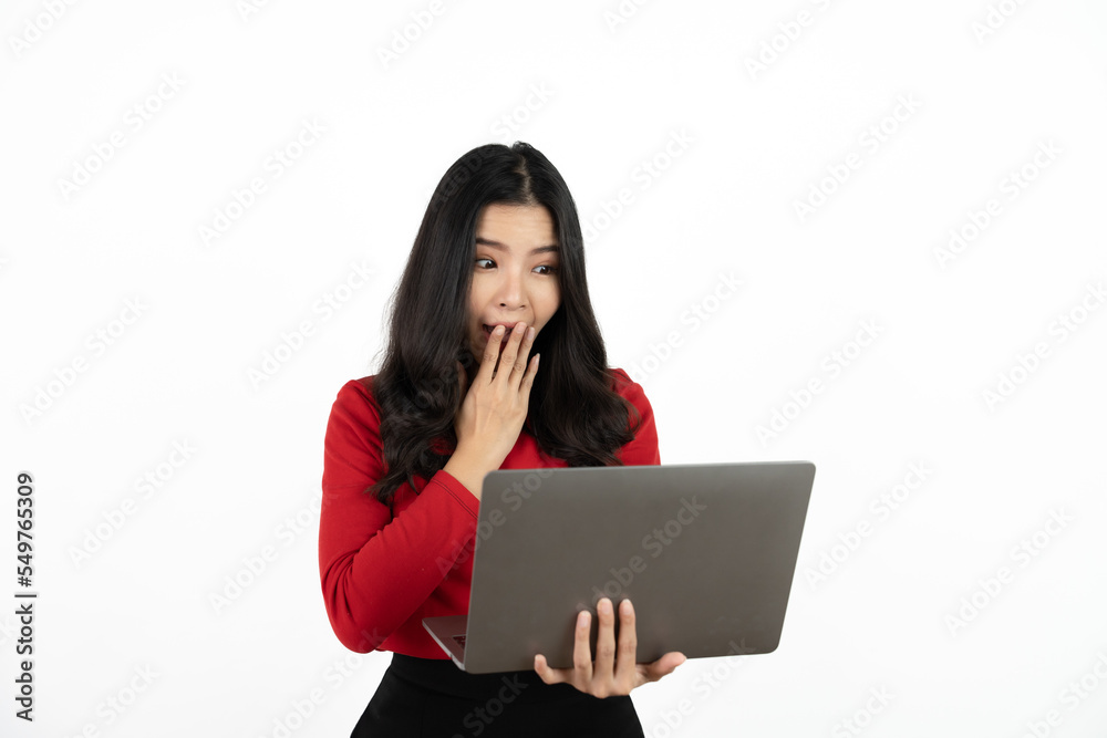 Happy asian business woman holding laptop computer and looking at the camera over white background. Happy asian business woman holding laptop computer and looking at the camera over white background.
