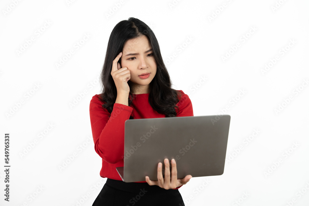 Happy asian business woman holding laptop computer and looking at the camera over white background. Happy asian business woman holding laptop computer and looking at the camera over white background.