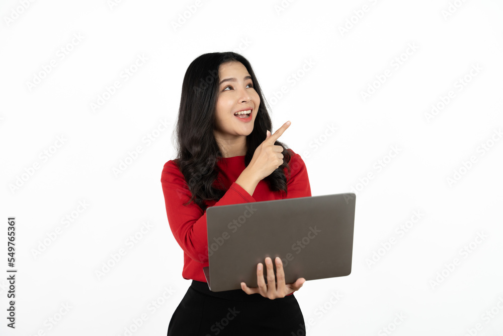 Happy asian business woman holding laptop computer and looking at the camera over white background. Happy asian business woman holding laptop computer and looking at the camera over white background.