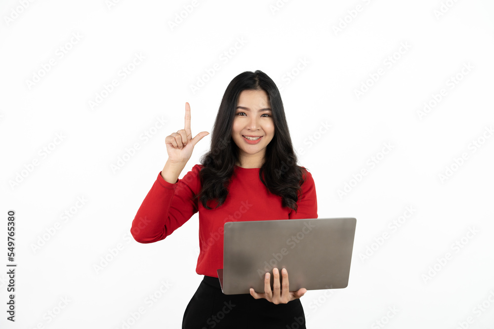 Happy asian business woman holding laptop computer and looking at the camera over white background. Happy asian business woman holding laptop computer and looking at the camera over white background.