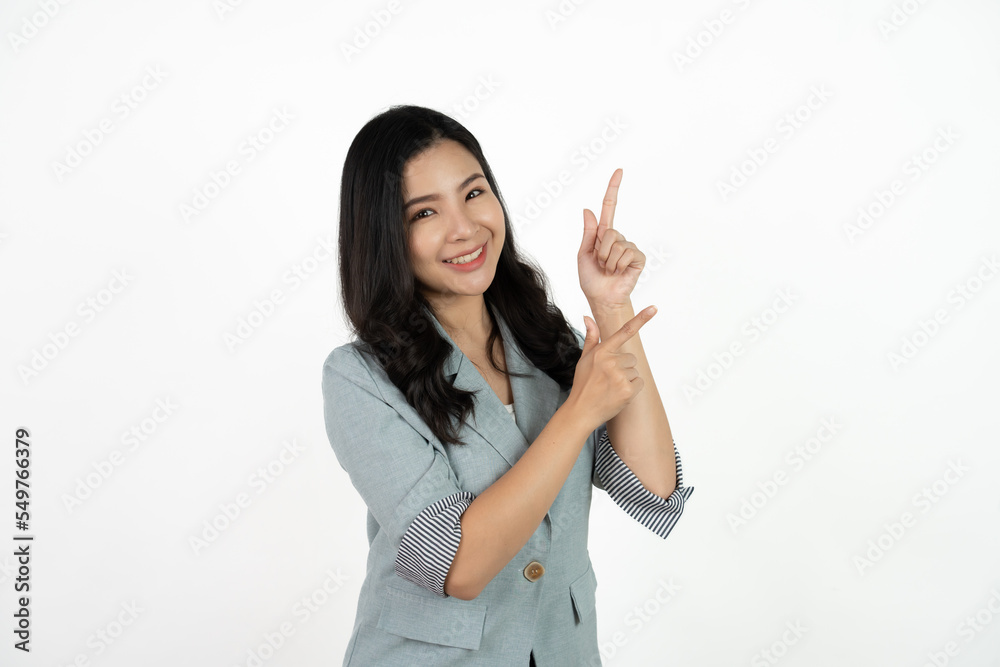 Asian business woman isolated on white background pointing to the side to present a product. Asian business woman isolated on white background pointing to the side to present a product.