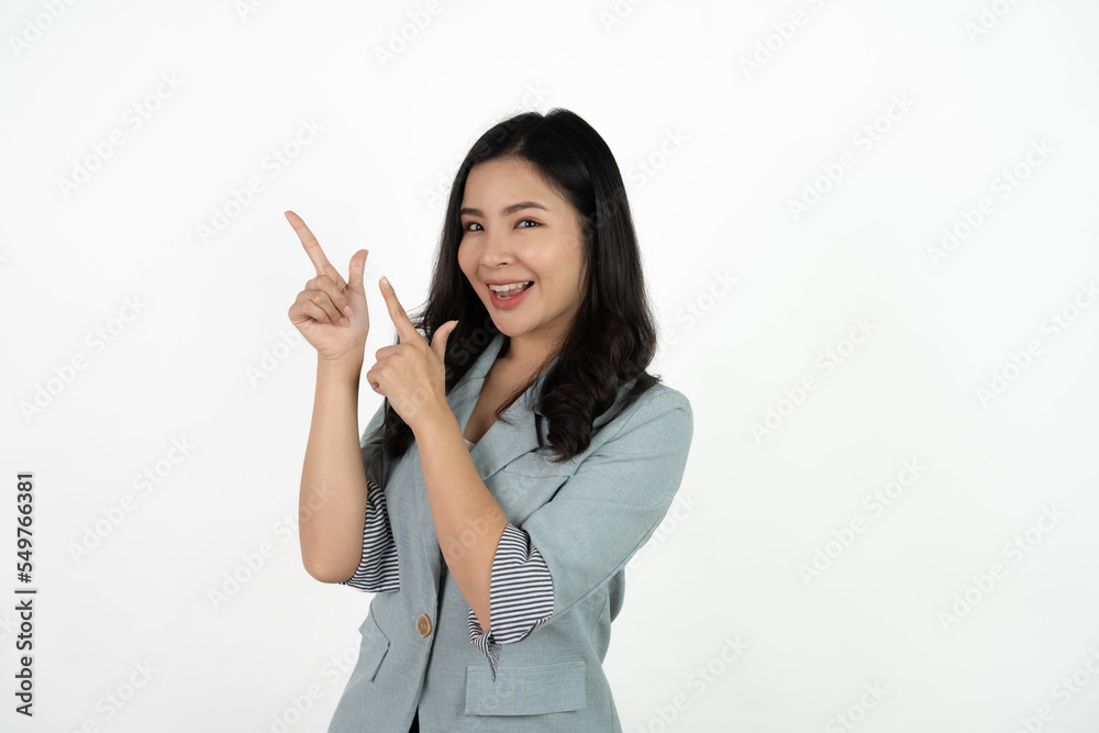 Asian business woman isolated on white background pointing to the side to present a product. Asian business woman isolated on white background pointing to the side to present a product.