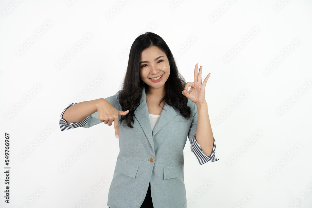 Portrait happy Asian woman shows ok sign and looking at the camera on white background. Portrait happy Asian woman shows ok sign and looking at the camera on white background.