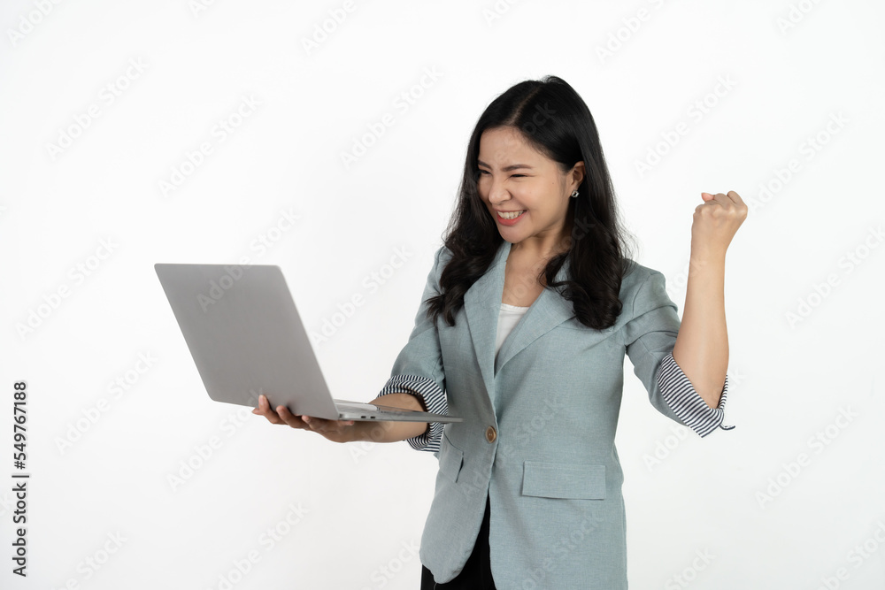 Happy asian business woman holding laptop computer and looking at the camera over white background. Happy asian business woman holding laptop computer and looking at the camera over white background.