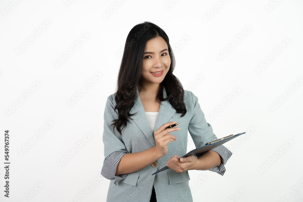 Portrait happy beautiful young asian business woman long hair standing and holding clipboard with looking to camera and smile over white background. Portrait happy beautiful young asian business woman long hair standing and holding clipboard with looking to camera and smile over white background.