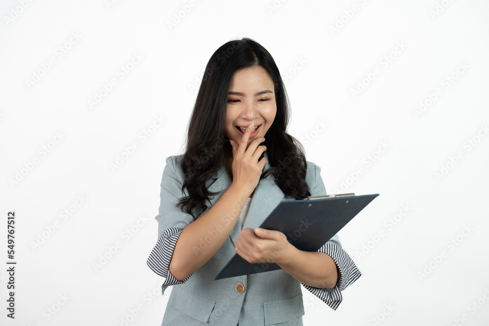 Portrait happy beautiful young asian business woman long hair standing and holding clipboard with looking to camera and smile over white background. Portrait happy beautiful young asian business woman long hair standing and holding clipboard with looking to camera and smile over white background.