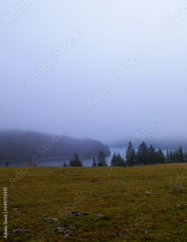 Foggy day in Krzeszna, Ostrzyckie lake and Wiezyca hills Poland photo