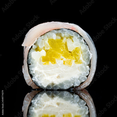 Fresh sushi roll with yellow sweet pepper, cream cheese and white fish.
