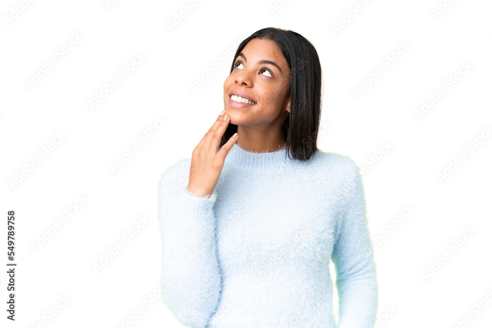 Young African American woman over isolated chroma key background looking up while smiling Young African American woman over isolated chroma key background looking up while smiling