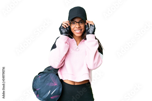 Young sport African American woman with sport bag over isolated chroma key background with glasses and surprised