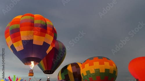 Pattaya, Thailand. Colourful hot air balloon flying with beautiful sky in the evening with basket floating aerial view.