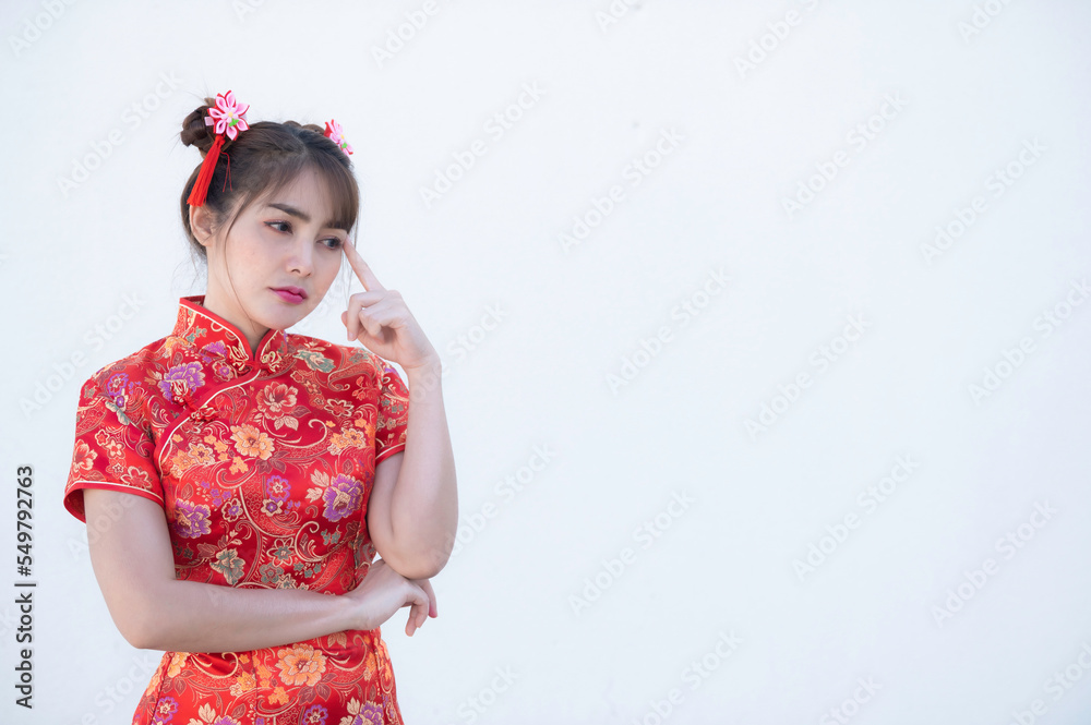 Portrait beautiful asian woman in Cheongsam dress on white background,Thailand people,Happy Chinese new year concept,Happy asian lady in chinese traditional dress Portrait beautiful asian woman in Cheongsam dress on white background,Thailand people,Happy Chinese new year concept,Happy asian lady in chinese traditional dress