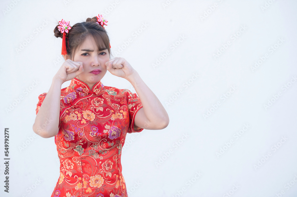 Portrait beautiful asian woman in Cheongsam dress on white background,Thailand people,Happy Chinese new year concept,Happy asian lady in chinese traditional dress Portrait beautiful asian woman in Cheongsam dress on white background,Thailand people,Happy Chinese new year concept,Happy asian lady in chinese traditional dress