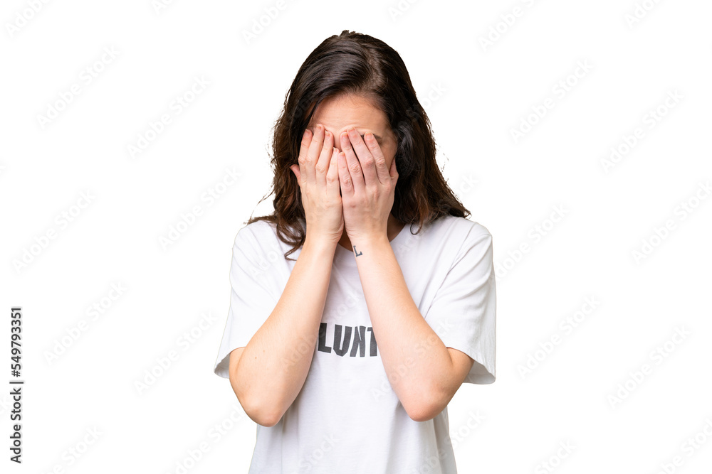 Young volunteer caucasian woman over isolated background with tired and sick expression Young volunteer caucasian woman over isolated background with tired and sick expression