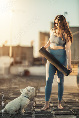 Woman Preparing Yoga Mat And Preparing To Outdoors Training