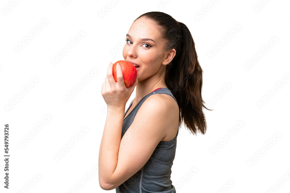 Young caucasian woman over isolated background eating an apple Young caucasian woman over isolated background eating an apple