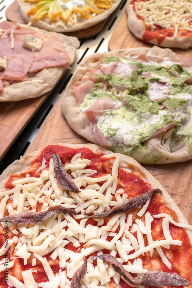 Raw pizzas