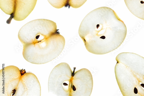 Backlit apple and pear slices.