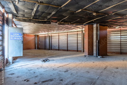 Interior view of unfurbished commercial space ready for rental in a new building