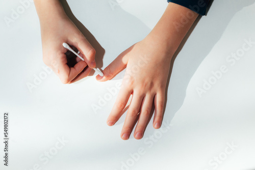 Children's hand with a wart on a white background. Papilomavirus. Top view