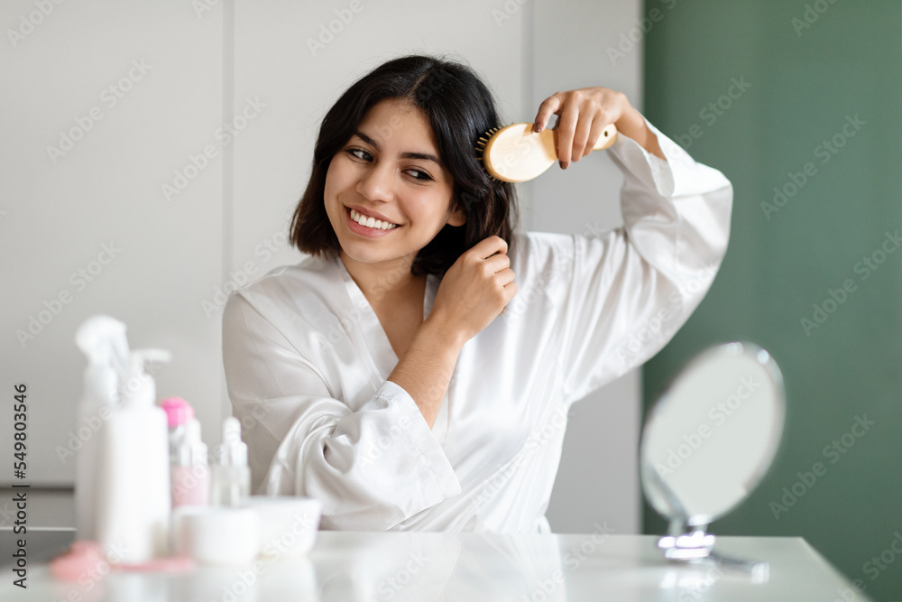 Pretty Woman Combing Her Beautiful Hair With Brush At Home Pretty Woman Combing Her Beautiful Hair With Brush At Home