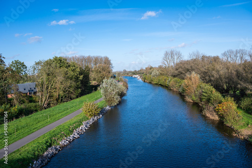 Bridge view over the River Dender and nature surroundings around Gijzegem, Belgium