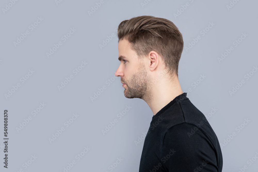 man with stubble isolated on grey background. face of caucasian man having stubble. man with stubble isolated on grey background. face of caucasian man having stubble.
