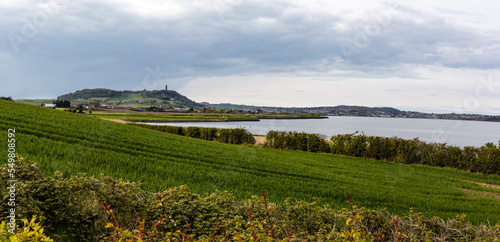 Panoramic scene of Strangford Lough  green fields and Scrabo tower on the top of the hill. Northern Ireland  UK