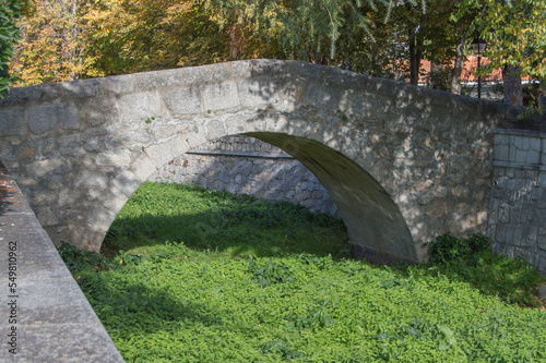 small stone bridge in Colmenar del Arroyo, province of Madrid. Spain