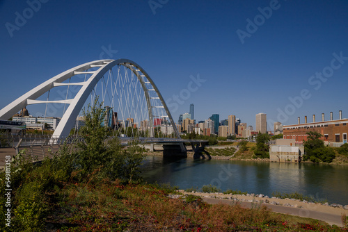 Modern arc bridge over the river,  day traffic, summer time. modern architecture, panorama of the city Edmonton © joi