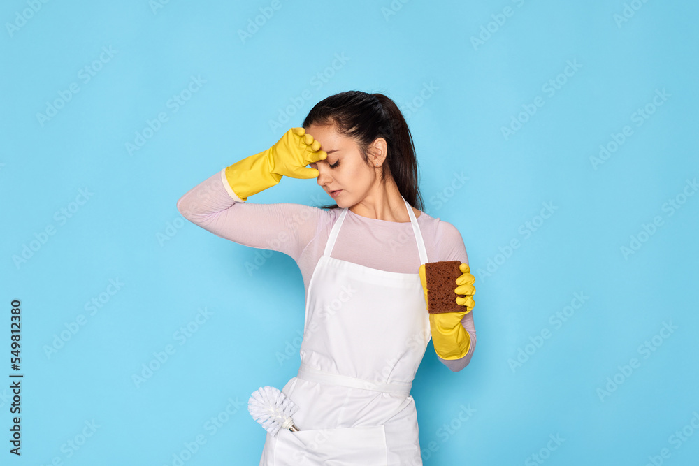 tired woman gloves and cleaner apron with sponge tired woman gloves and cleaner apron with sponge