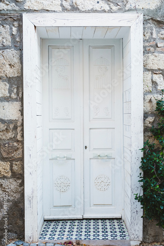 Charming old House with white wooden door.