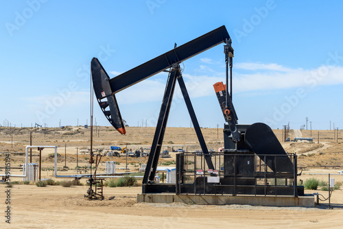 Close up of a pumpjack in a oil field in California on a clear autumn day