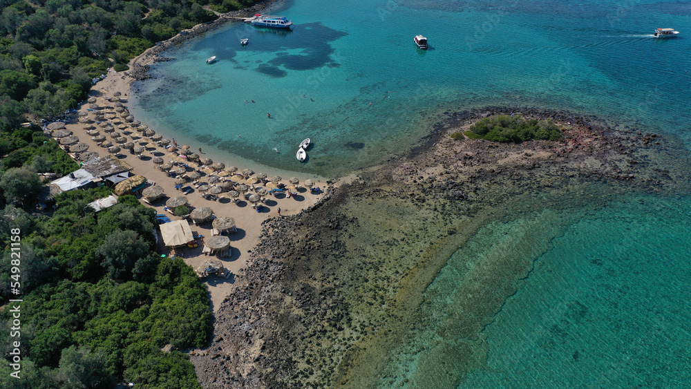 Aerial drone photo of tropical exotic paradise volcanic island complex bay with deep turquoise sea forming a blue lagoon archipelago visited by luxury yachts and sail boats