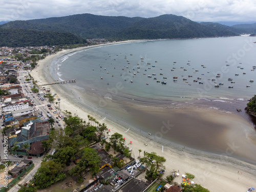 beautiful fishermen's beach formed in a bay in the mountains, Pereque, Guarujá, Brazil photo