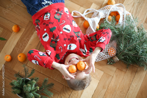 Funny kid on Christmas eve. Xmas holiday concept
