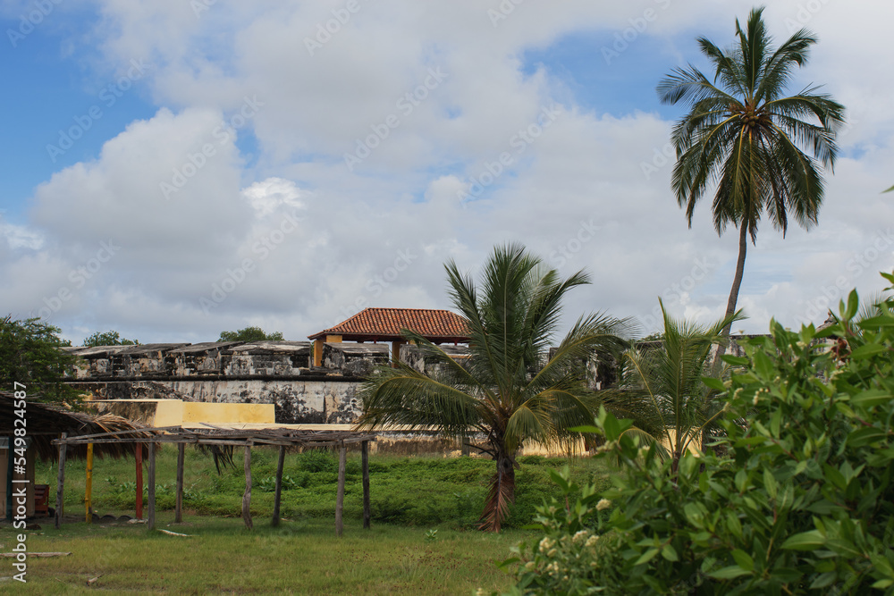 san fernando de bocachica fort surrounded by beautiful green vegetation and palm trees in bocachica island