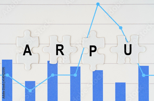 On business reports - diagrams are puzzles with the inscription - ARPU