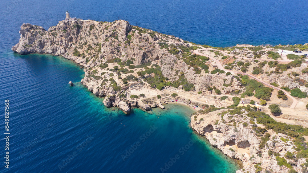 Aerial drone photo of famous archaeological site of Heraion in Cape Melagavi featuring a small beach next to iconic lake Vouliagmeni and lighthouse, Corinthian bay, Perachora, Loutraki, Greece