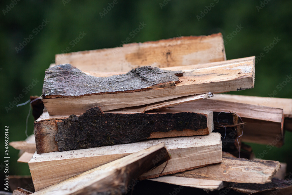 Pile of a chopped wood ready for heating the house in winter season Pile of a chopped wood ready for heating the house in winter season