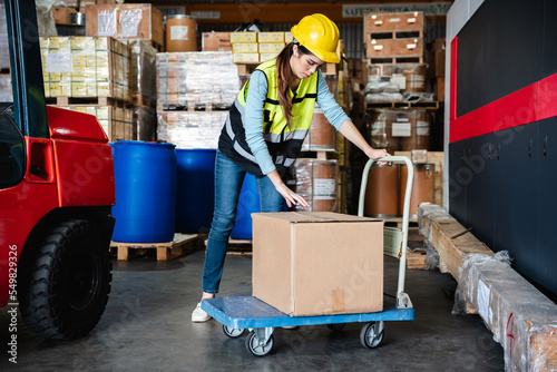 Warehouse worker checking the quantity of storage products in the warehouse., Industrial and industrial concept.