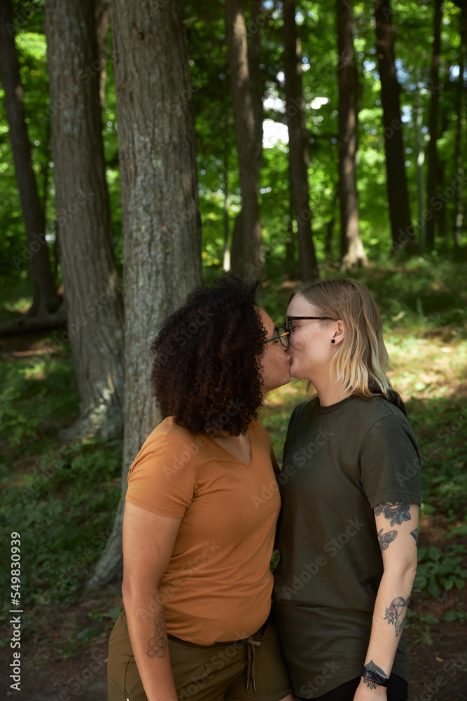 Portrait of female LGBTQ couple in campground missing