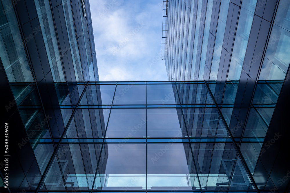 Obraz premium Reflections in glass facade of an office high rise.