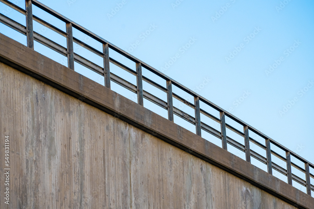 Metal rails of a concrete off ramp.