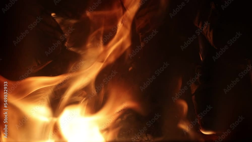 Fireplace with burning firewood or wood stove, slo-mo. Fireplace with burning firewood or wood stove, slo-mo.