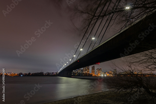 Under the bridge across the river at night