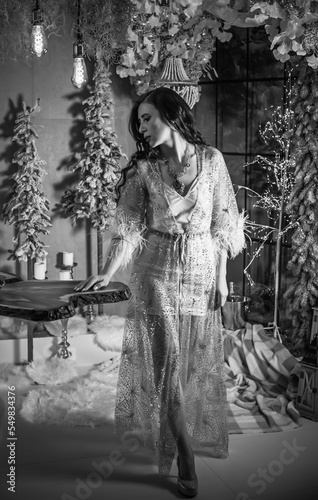 Wallpaper Mural Winter holidays concept. Inspiration and fairy time. Middle aged woman near Christmas tree. Pretty nice cozy days, magical New Year time Torontodigital.ca