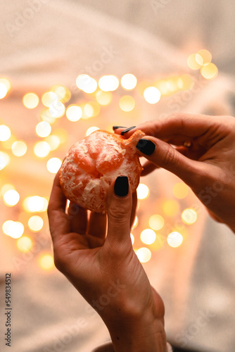 hand holding a mandarine