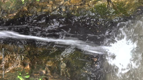 Hot spring. Medicinal water from stream. Vertical video photo