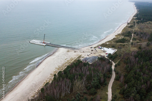 Construction of a breakwater designed to stop coastal erosion, Skede, Latvia. photo